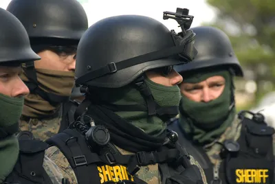 Spec ops police officer SWAT in black uniform and face mask, studio shot.  Poster Print by Oleg Zabielin/Stocktrek Images - Item # VARPSTZAB101466M -  Posterazzi