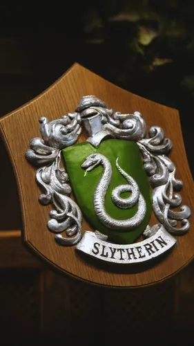 Гарри Поттер Слизерин Обои на телефон металлический предмет с символом