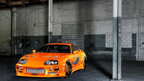 Toyota Supra Обои на телефон оранжевый спортивный автомобиль, припаркованный в гараже