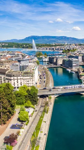 Швейцария Обои на телефон город с фонтаном посреди него