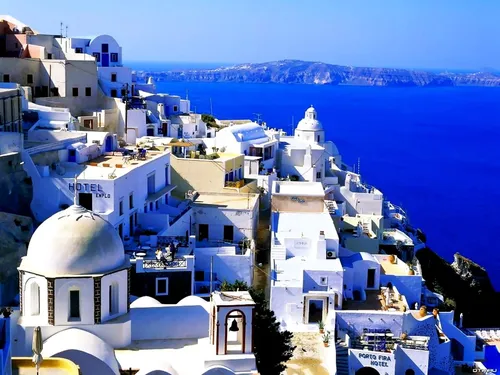 Греция Обои на телефон город с белыми зданиями у воды