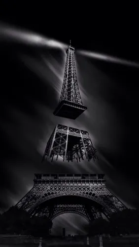 Черно Белое Фото высокая башня ночью на фоне Эйфелевой башни