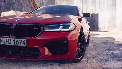 Bmw m5 f90 driving through city streets on Craiyon