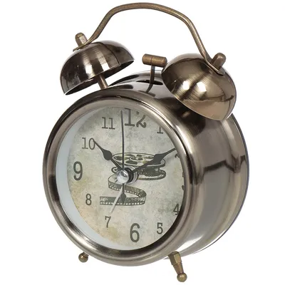Foto Stock часы будильник стоит дома на столе утром | Adobe Stock