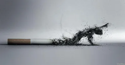 Молодой человек курит сигарету на черном фоне :: Стоковая фотография ::  Pixel-Shot Studio