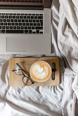 White office desk table with smartphone, laptop computer, cup of coffee and  supplies. Top view with copy space, flat lay. Stock Photo | Adobe Stock