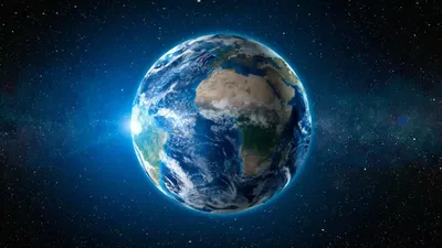 В космосе горит одна большая планета синим цветом под названием Земля - обои  на рабочий стол