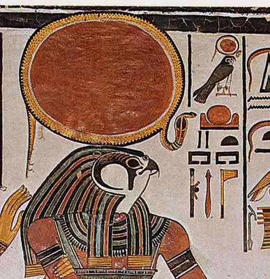Фото Египетский Бог солнца Ра с посохом на фоне здания