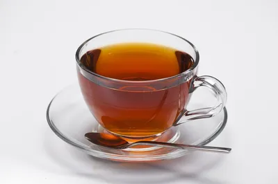 стеклянная чашка с чаем на стеклянном блюдце Stock Photo | Adobe Stock