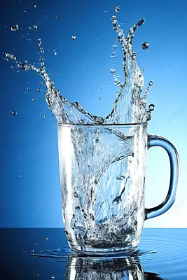 Стакан с водой на столе Stock Photo | Adobe Stock