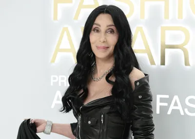 Cher Suits Up With Boyfriend at Balmain's Spring 2024 Runway Show