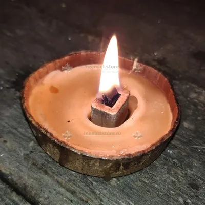Горящая свеча на деревяном подсвечнике Stock Photo | Adobe Stock