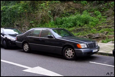 A mercedes benz w140 with lowered suspesion and a widebody kit on Craiyon