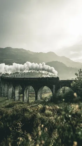 С Гарри Поттером Обои на телефон каменный мост с дымом, выходящим из него