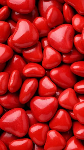 Конфеты Обои на телефон куча красных конфет в форме сердца