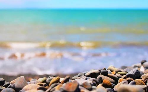 Море Пляж Обои на телефон скалистый пляж с голубой водой