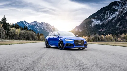 Audi Rs6 Обои на телефон синий спортивный автомобиль на дороге с горами на заднем плане