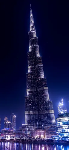 Дубай Обои на телефон высокое здание с подсветкой ночью