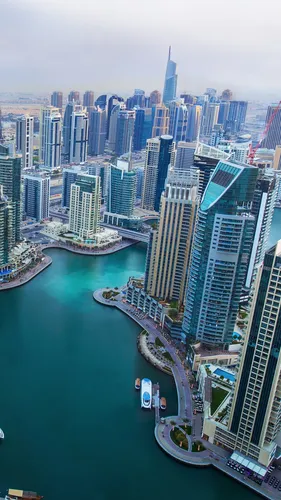Дубай Обои на телефон город с протекающей через него рекой