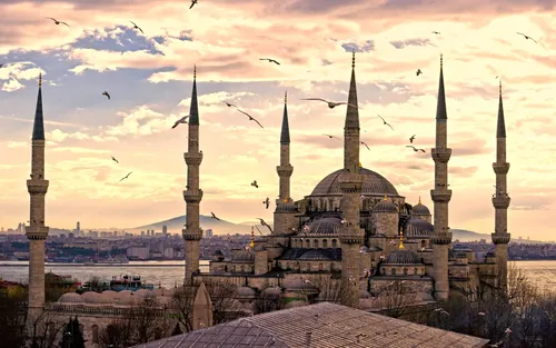 Исламские Фото Обои на телефон здание с башнями и летающими птицами
