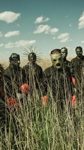 Slipknot Обои на телефон группа людей в одежде в поле
