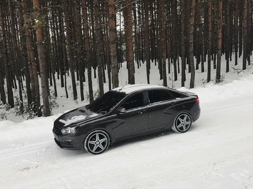 Лада Веста Обои на телефон черный автомобиль, припаркованный в снегу