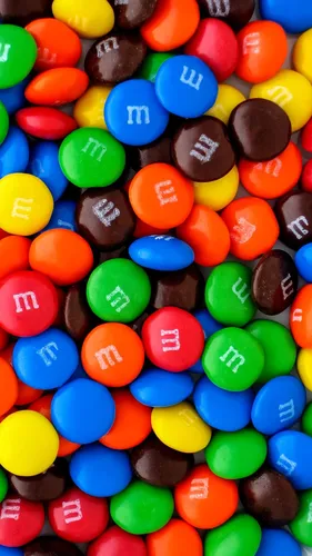 Сладости Обои на телефон куча разноцветных круглых конфет