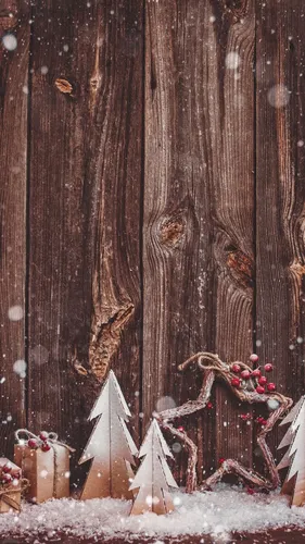 Зима Новый Год Обои на телефон группа деревянных предметов с бантами и лентами на них