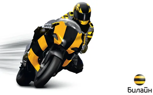 Билайн Обои на телефон человек в желто-черном костюме едет на мотоцикле