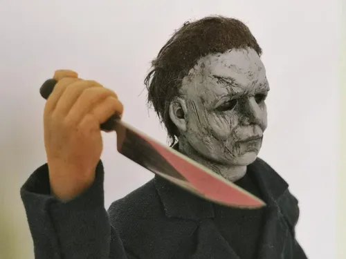 Майкл Майерс Обои на телефон мужчина в маске держит нож