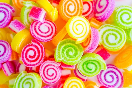 Макаруны Обои на телефон куча разноцветных конфет