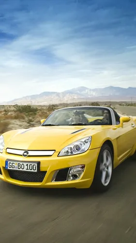 Опель Обои на телефон желтый спортивный автомобиль на дороге