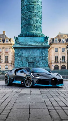 Bugatti Chiron Обои на телефон спортивный автомобиль, припаркованный перед большой башней