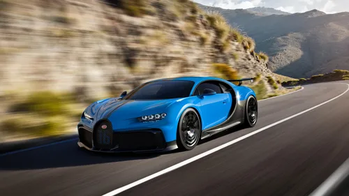 Bugatti Chiron Обои на телефон синий спортивный автомобиль, движущийся по дороге
