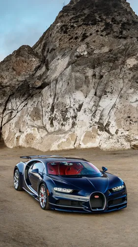 Bugatti Chiron Обои на телефон синий спортивный автомобиль, припаркованный перед скалистым утесом