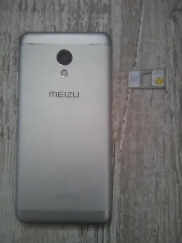 Мейзу М6 Обои на телефон белый прямоугольный предмет с черным кругом на нем