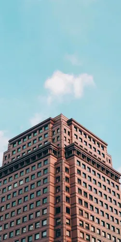 Здания Обои на телефон высокое здание с голубым небом