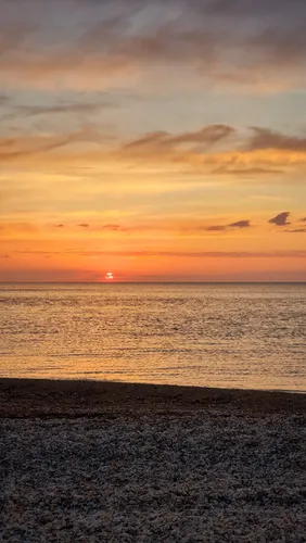 Природа Море Обои на телефон закат над пляжем